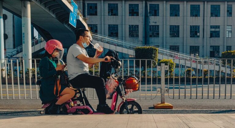 couple, electric bicycle, street